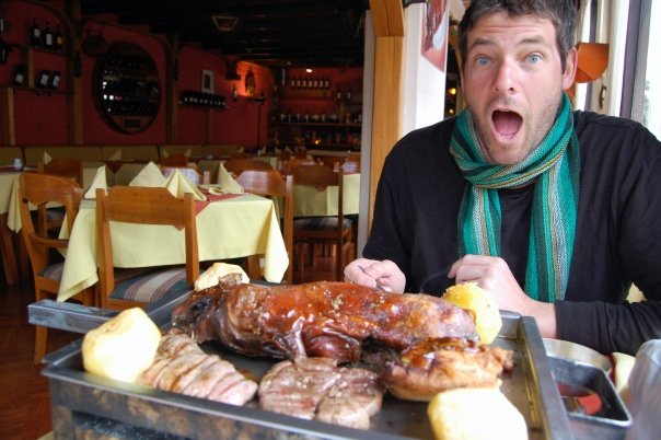 An eagles fan in Peru preparing to eat brutally murdered alpaca, lamb, and guinea pig, as wel as some seriously large papas